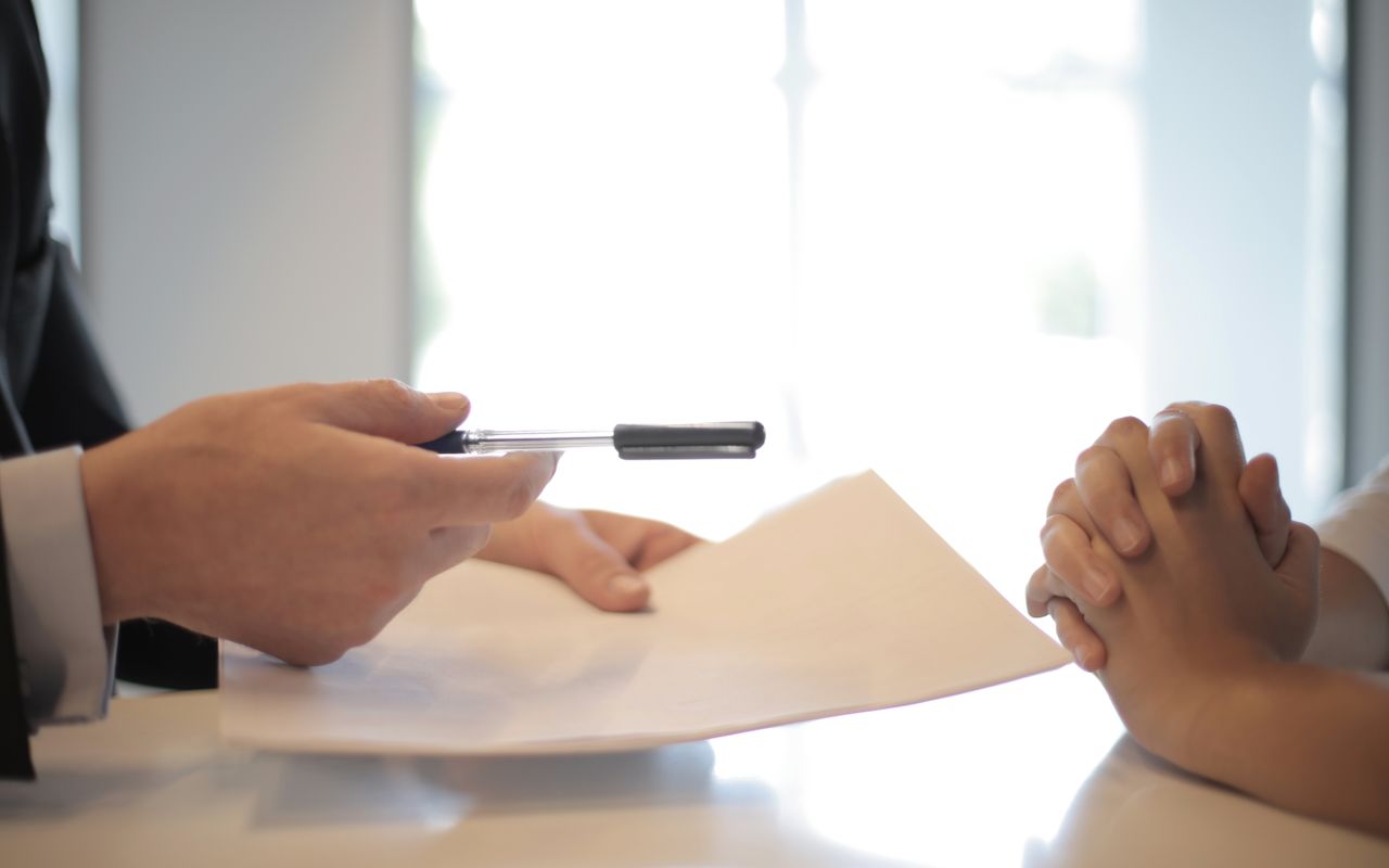 Signing a document during an administrative meeting